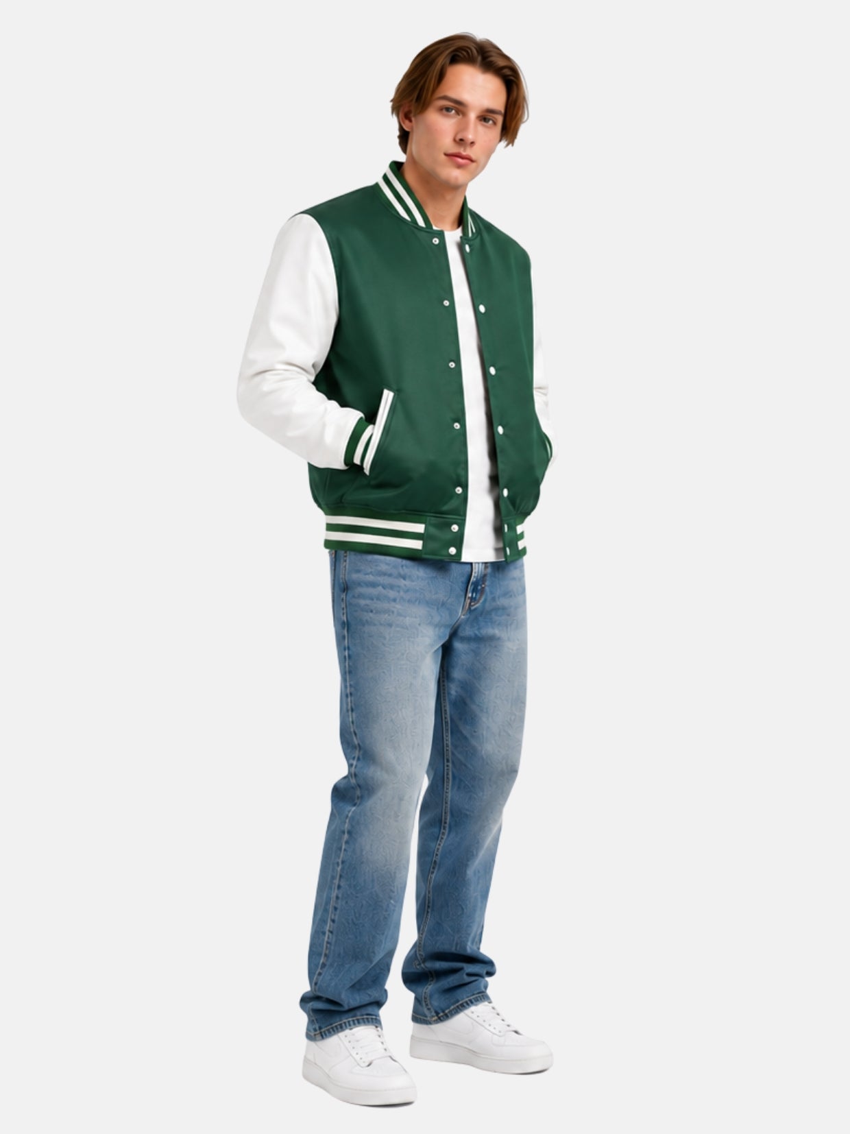 Full-length view of model in green and white satin varsity jacket with light-wash jeans