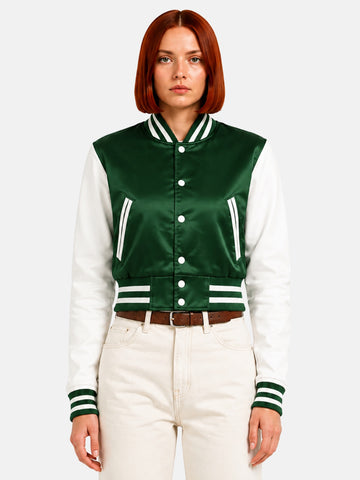 Model in green satin varsity jacket with white contrast sleeves, top snaps open over a white tee