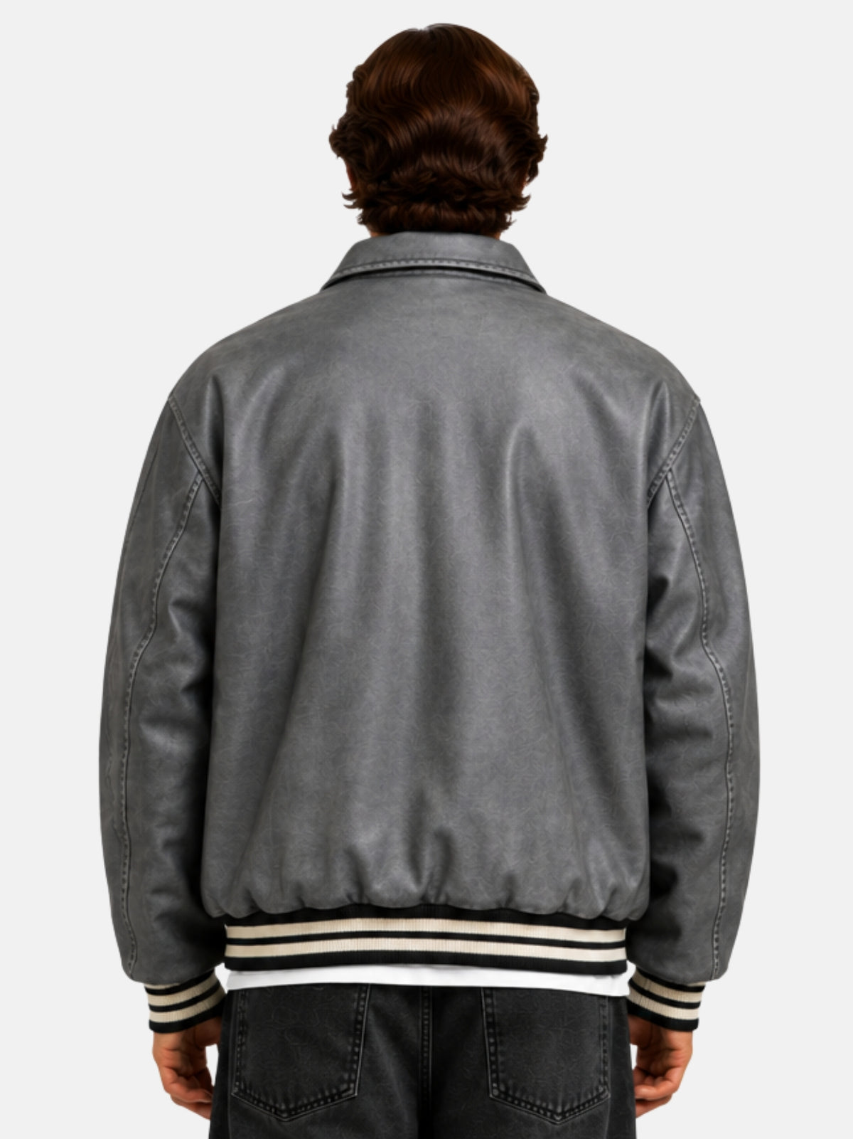 Back view of a grey distressed leather varsity jacket with striped rib hem on model