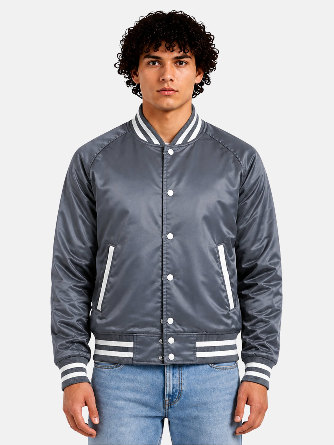 Man wearing a grey satin varsity jacket with white striped trims and snap front