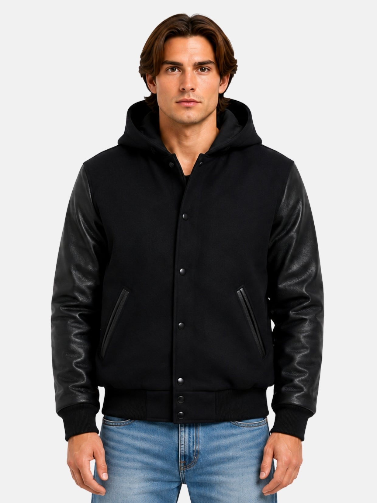 Man wearing black hooded varsity jacket with leather sleeves and matte snaps, size Medium