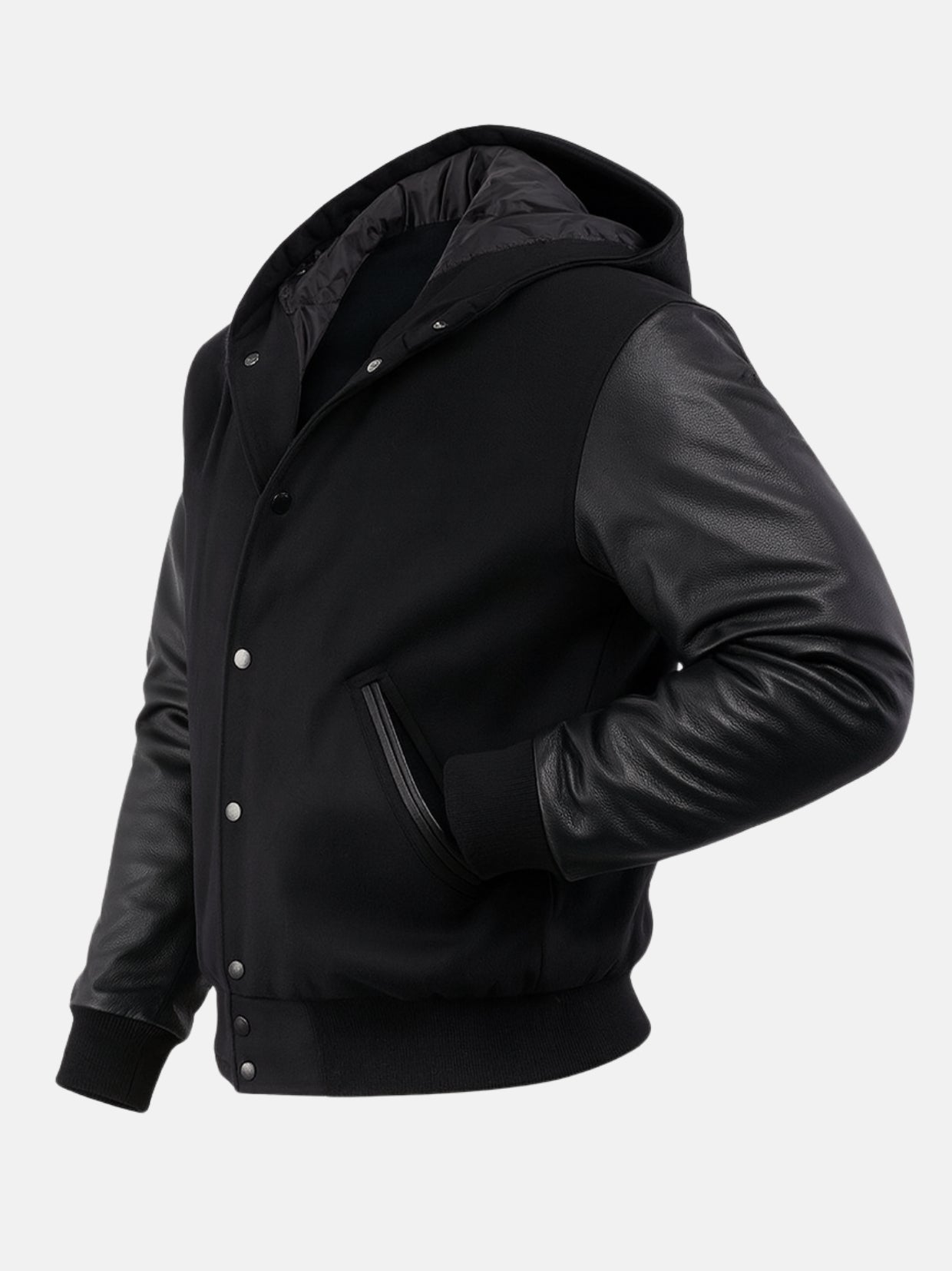 Angled view showing quilted hood lining and matte snaps on black wool varsity jacket