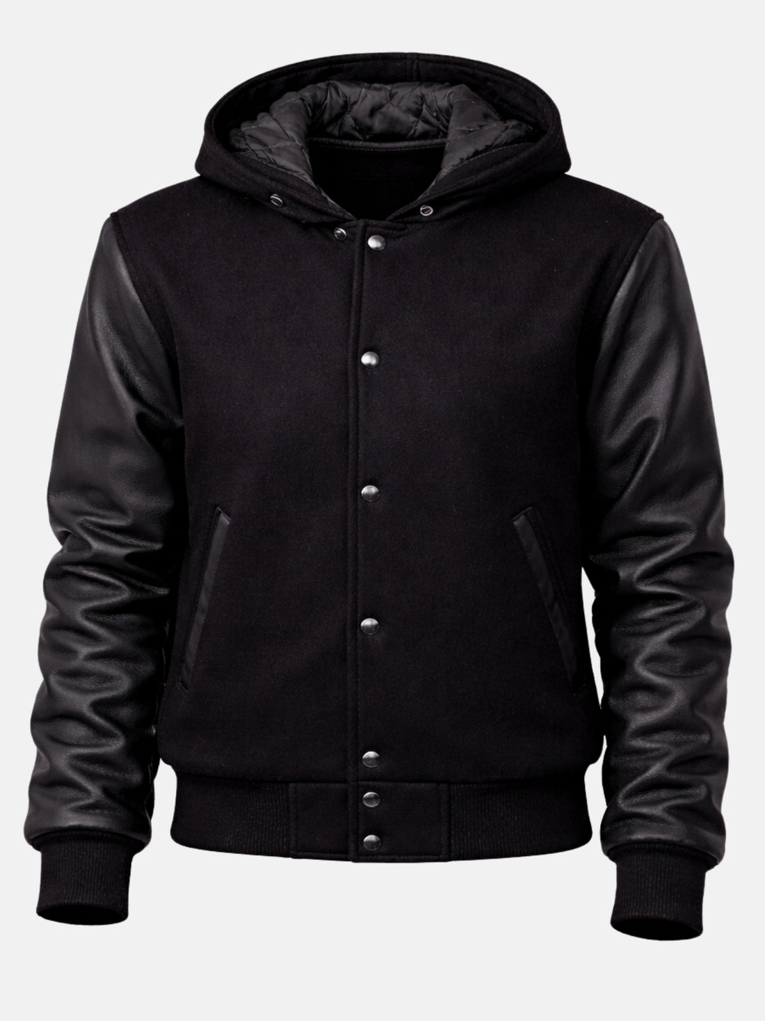 Woman wearing a black hooded varsity jacket with leather sleeves and hood up