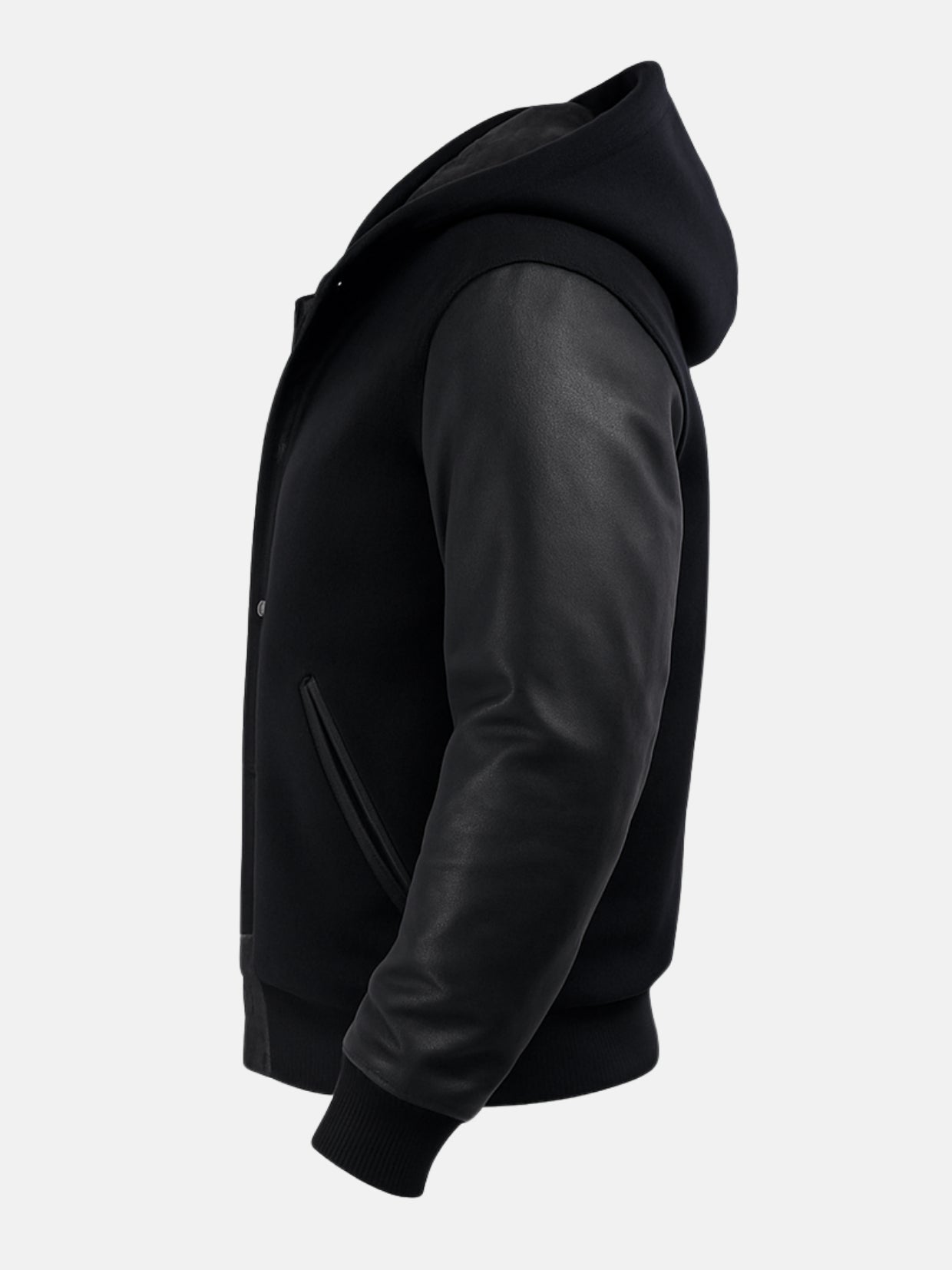Wool hood and pebbled cowhide sleeve on all-black varsity jacket, side view