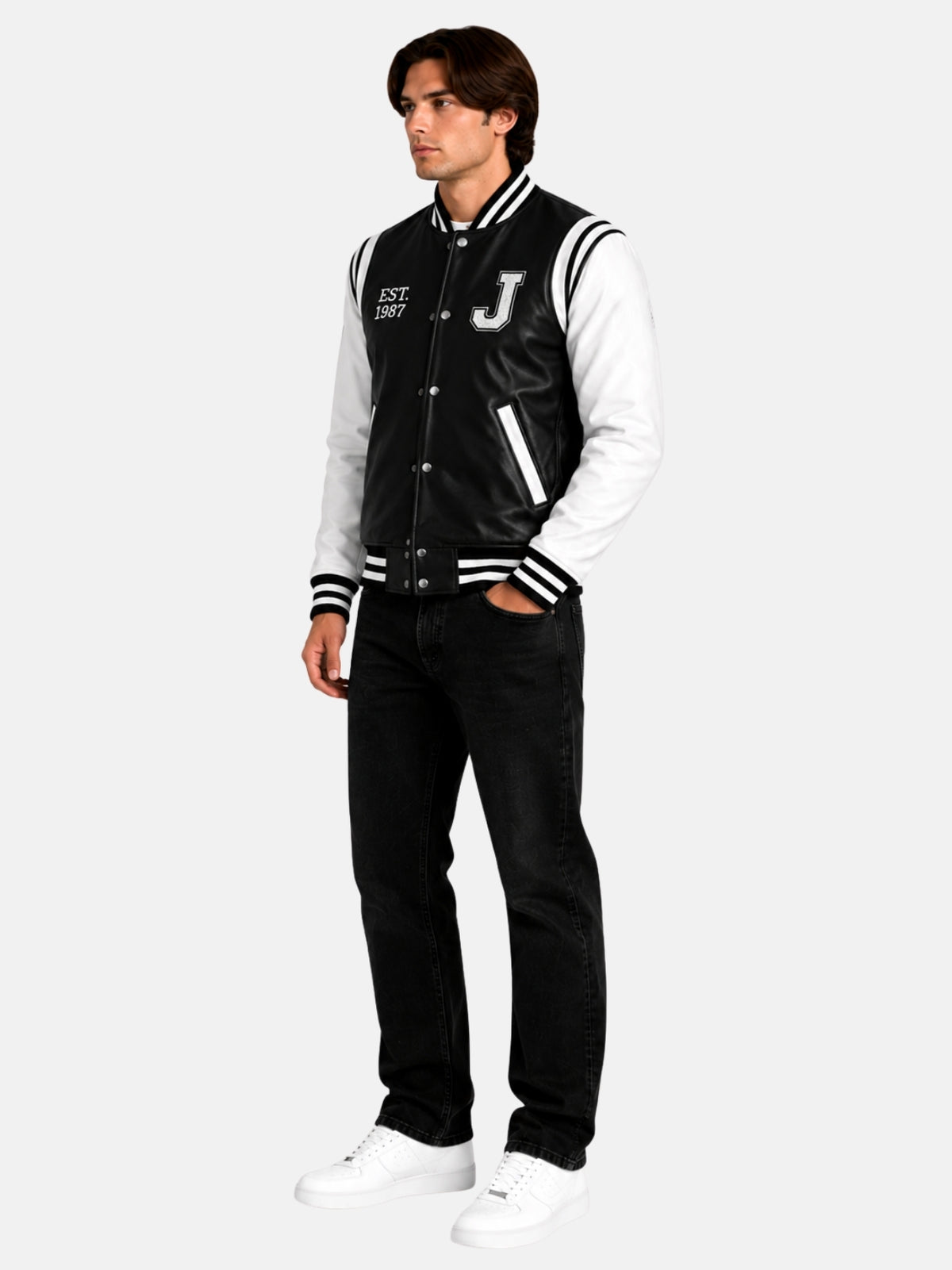 Full-length look with vintage black and white leather letterman jacket and black jeans