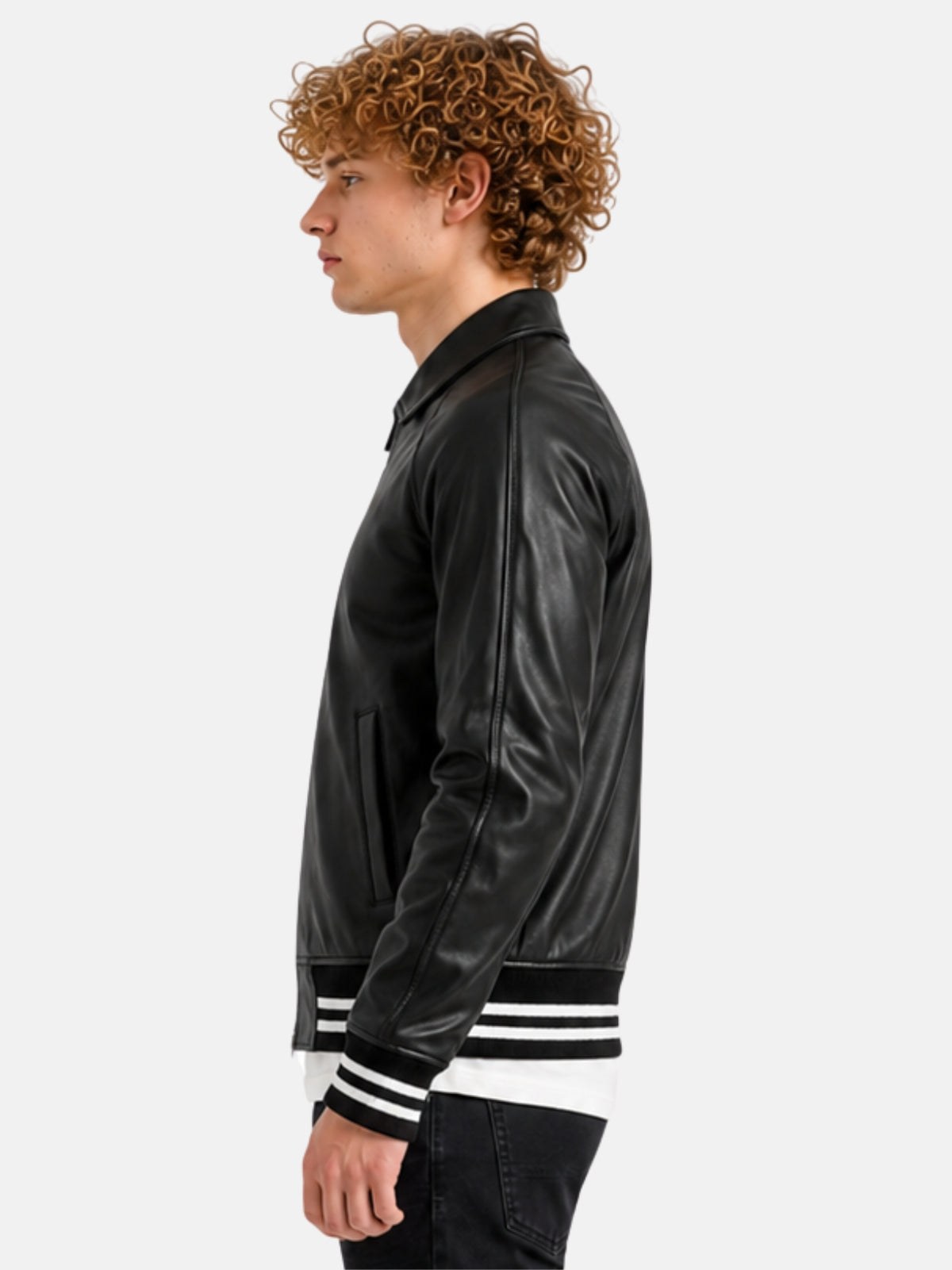 Side profile of black leather letterman jacket with raglan sleeve on model
