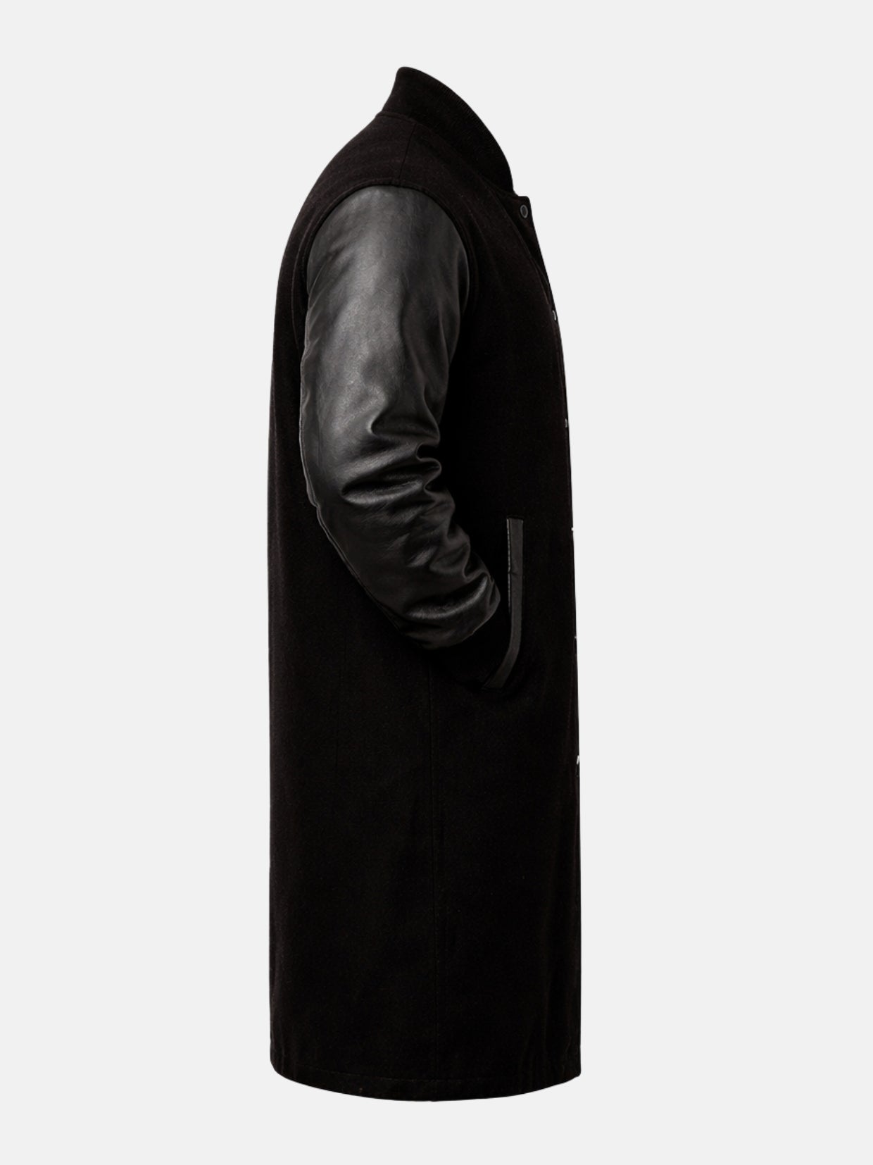 Leather sleeve and welt pocket of black wool varsity coat, side view
