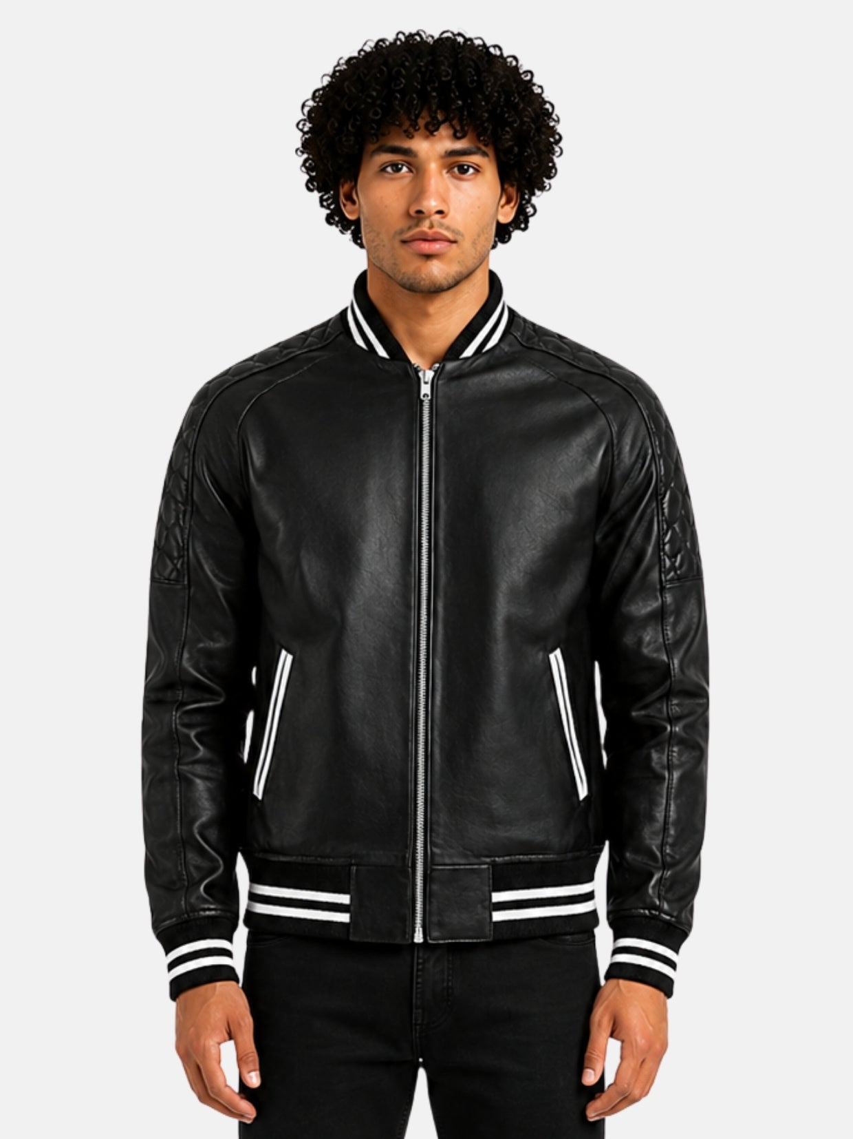 Man wearing black leather varsity bomber jacket with white striped trim and silver zip