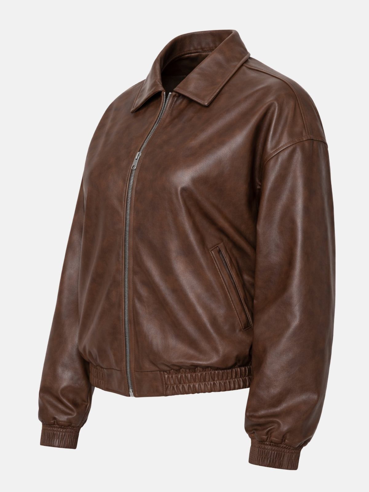 Women’s brown leather varsity bomber jacket with ribbed cuffs and hem, tilt view