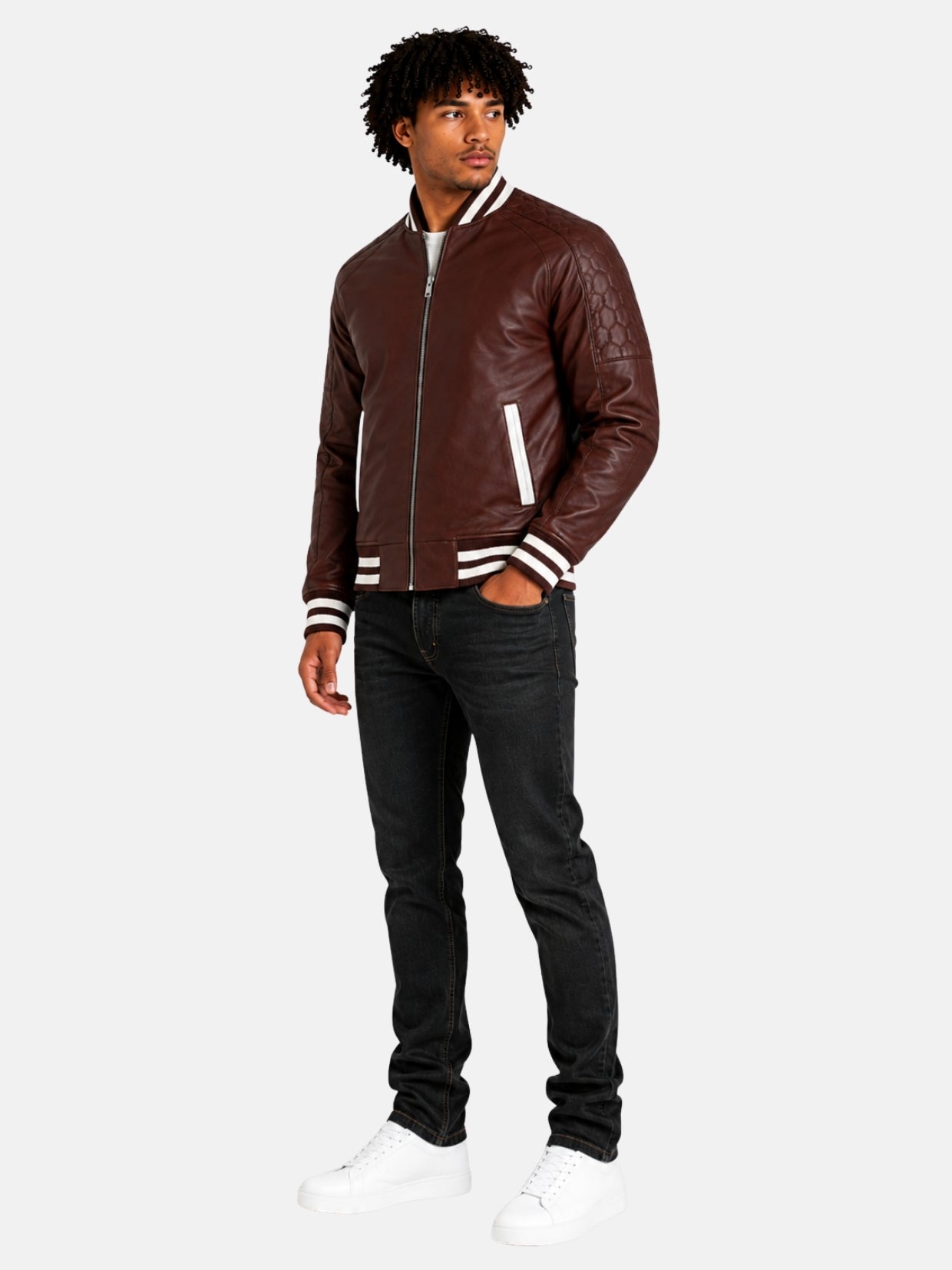 Full-length look with maroon leather varsity jacket, black jeans and white sneakers