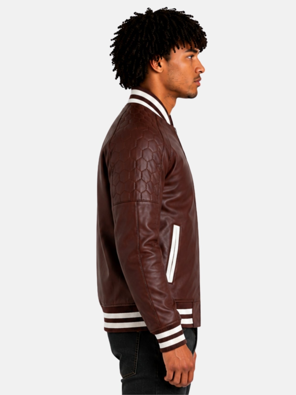 Side profile of maroon leather varsity jacket with quilted shoulder panel
