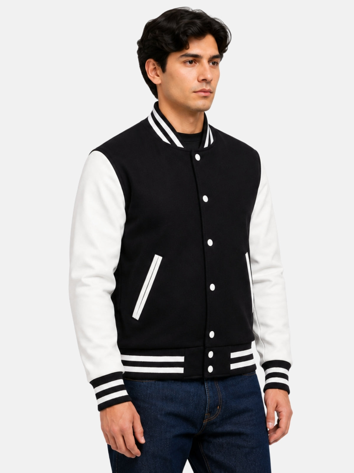 Three-quarter view of black wool varsity jacket with white leather sleeves on male model