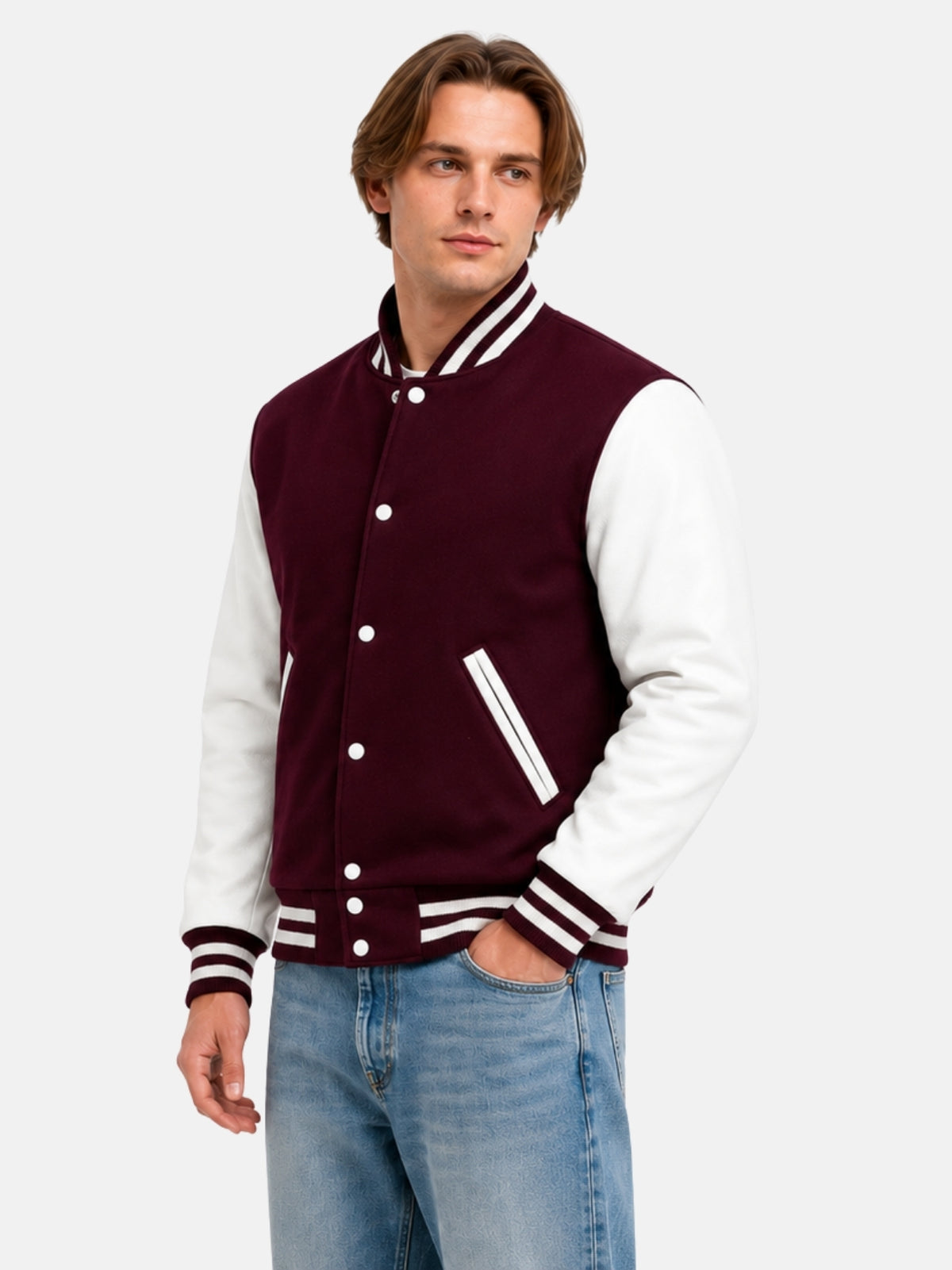 Three-quarter view of burgundy and white letterman jacket with light-wash jeans on model