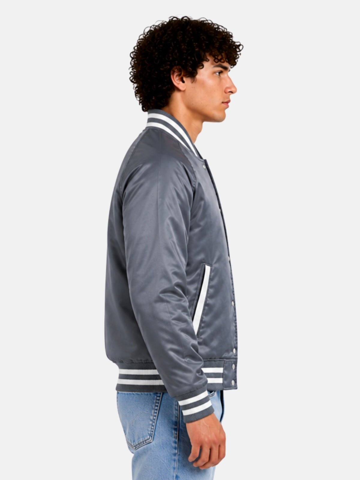Side profile of mens grey varsity jacket showing raglan sleeve and striped cuff