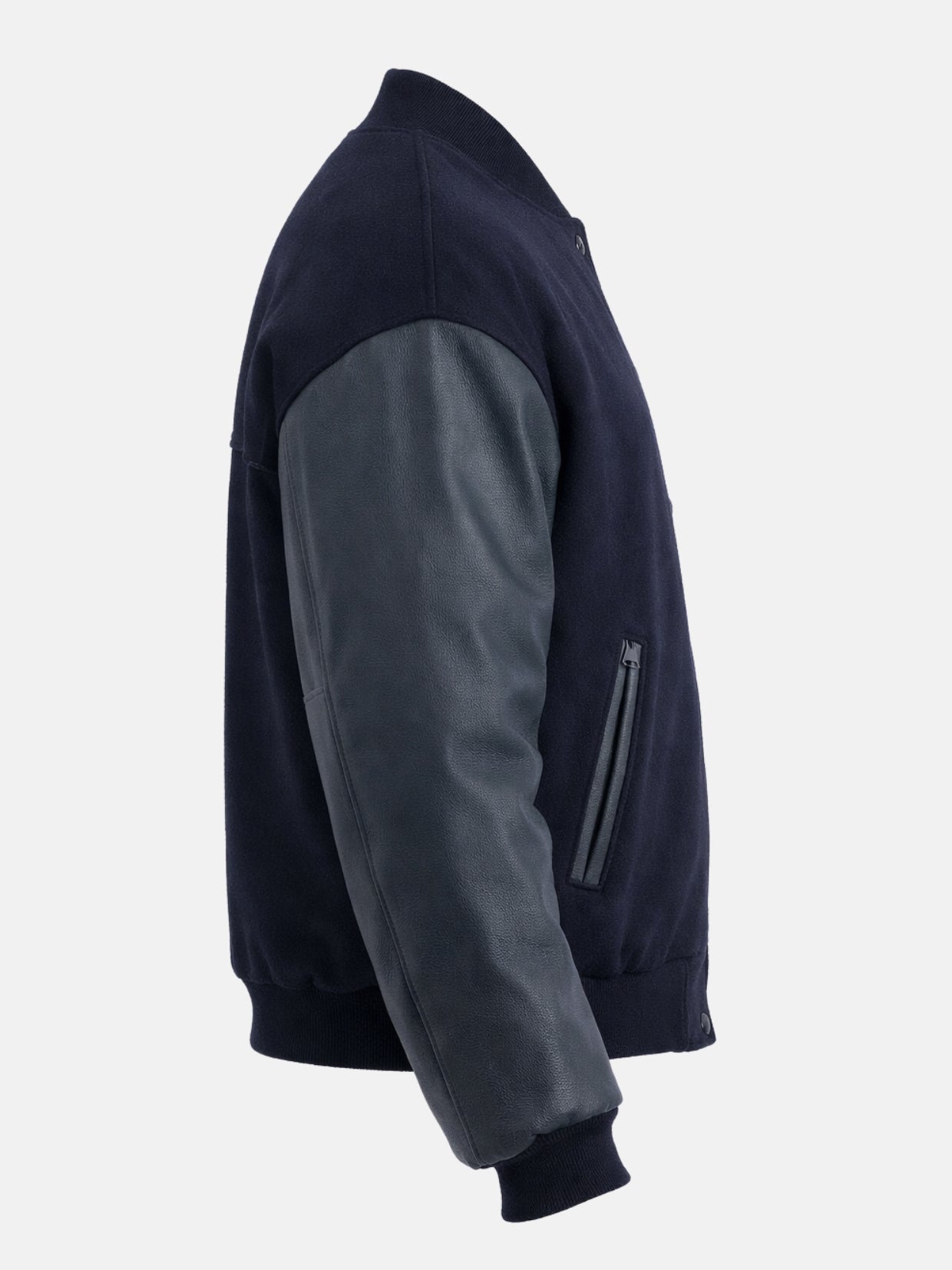 Side view of a navy letterman jacket showing zippered welt pocket and pebbled sleeve