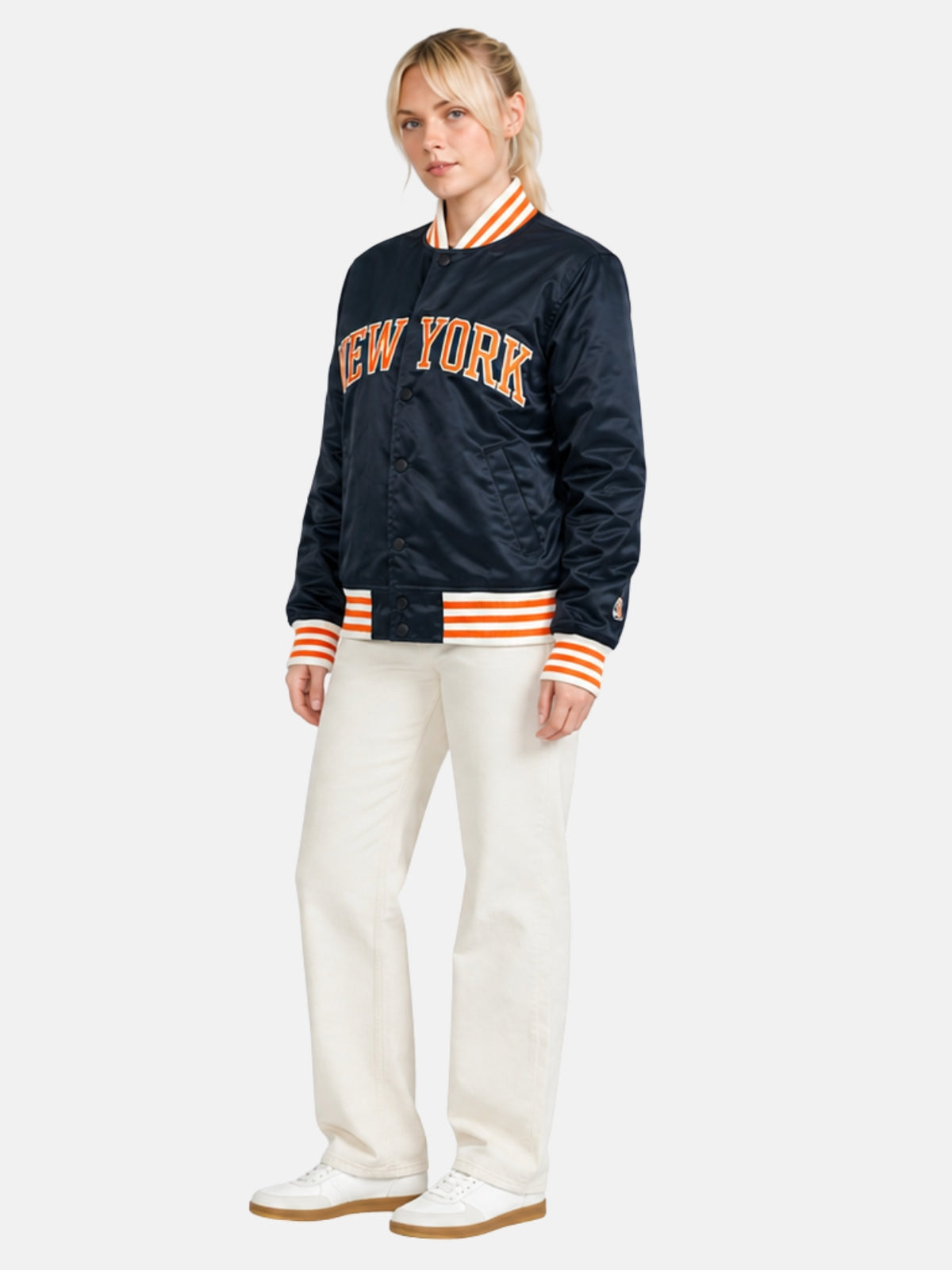 Angled full-body view of navy satin New York varsity jacket