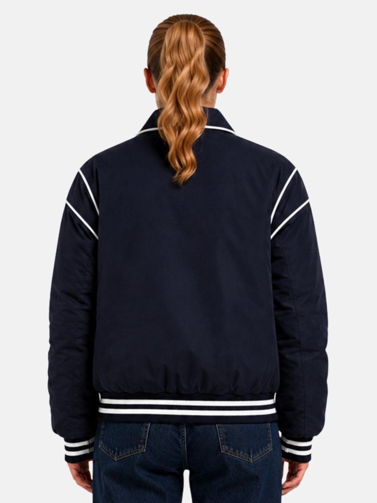 Back view of navy satin puffer jacket with mirrored white piped seam