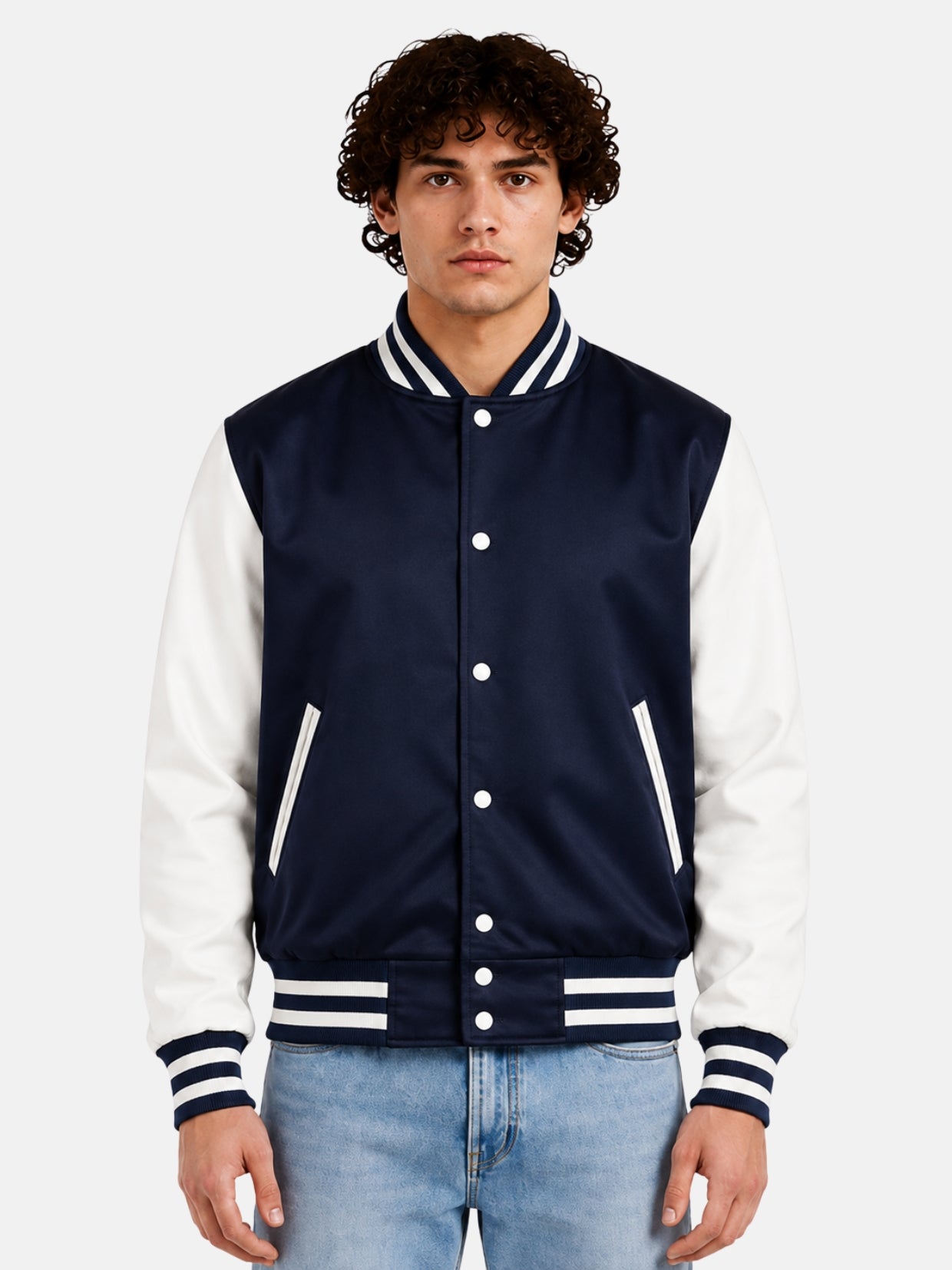 Man wearing a navy satin varsity jacket with white sleeves and striped rib trims, front view