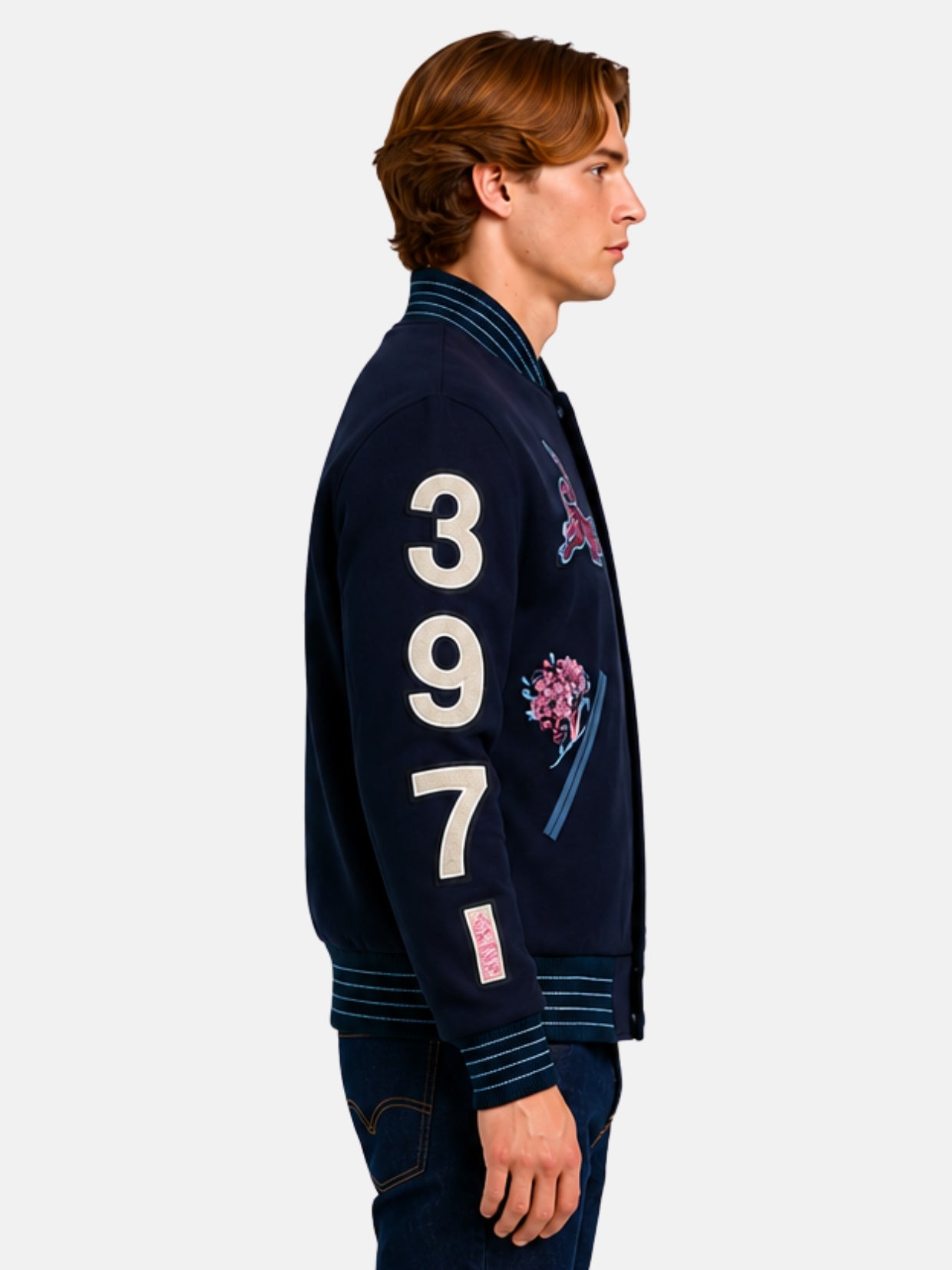 Side profile of navy varsity jacket showing 397 sleeve numbers and blossom patch