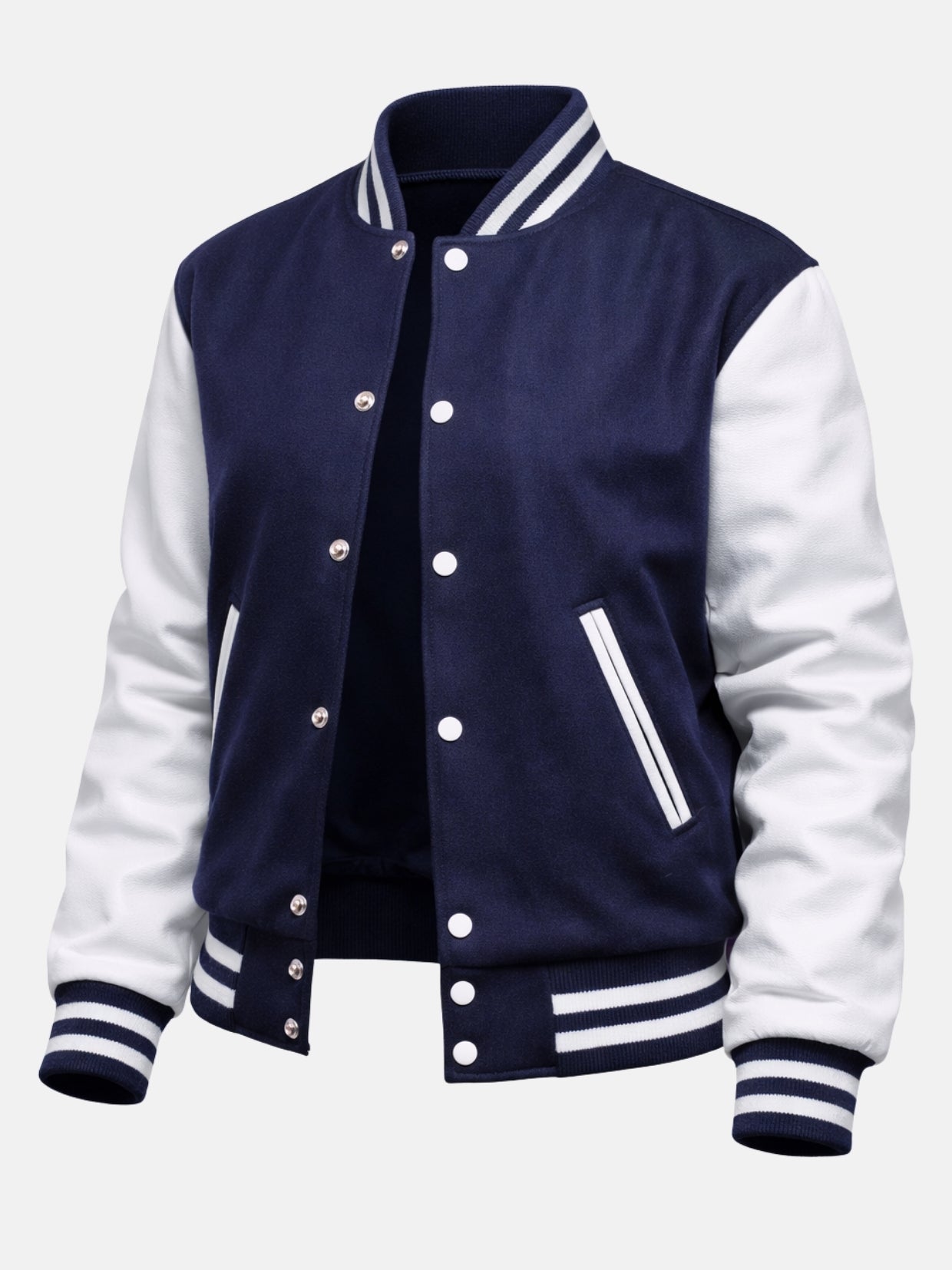 Angled front view of navy varsity jacket with white leather sleeves and snap placket