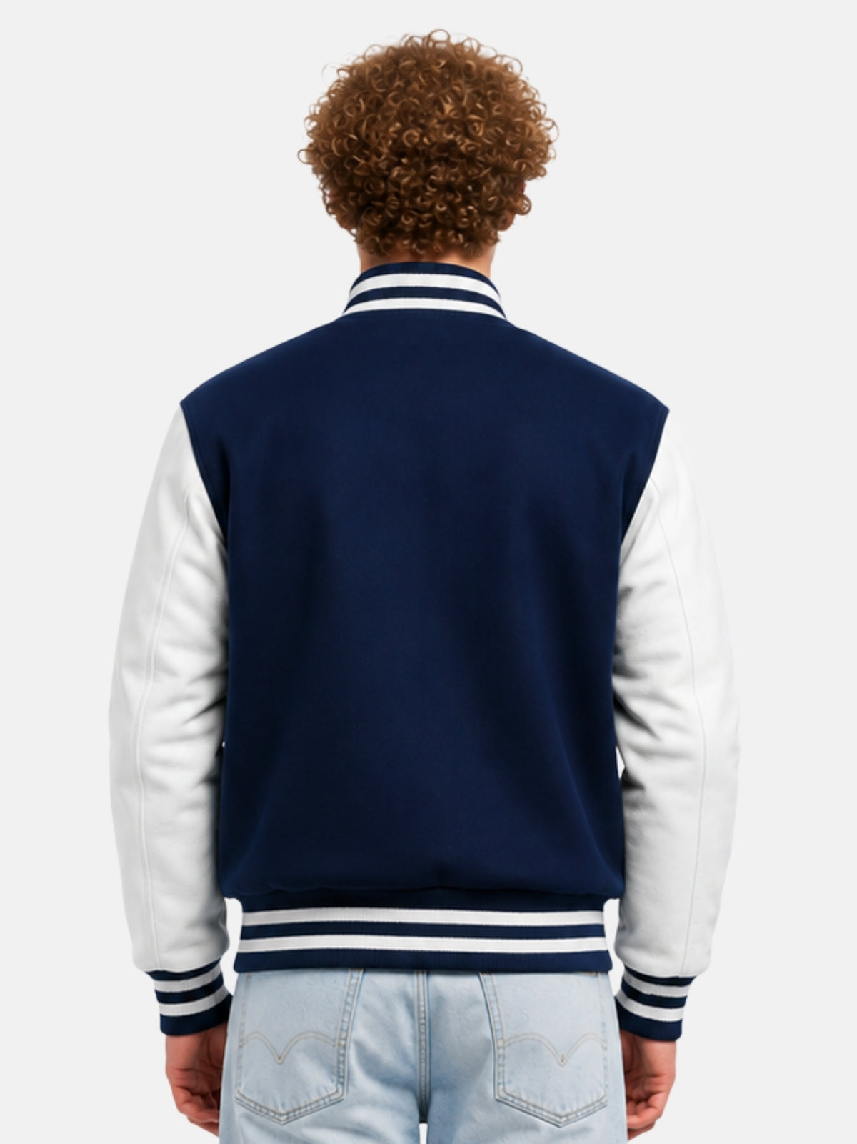 Model showing plain navy back panel of varsity jacket with white sleeves