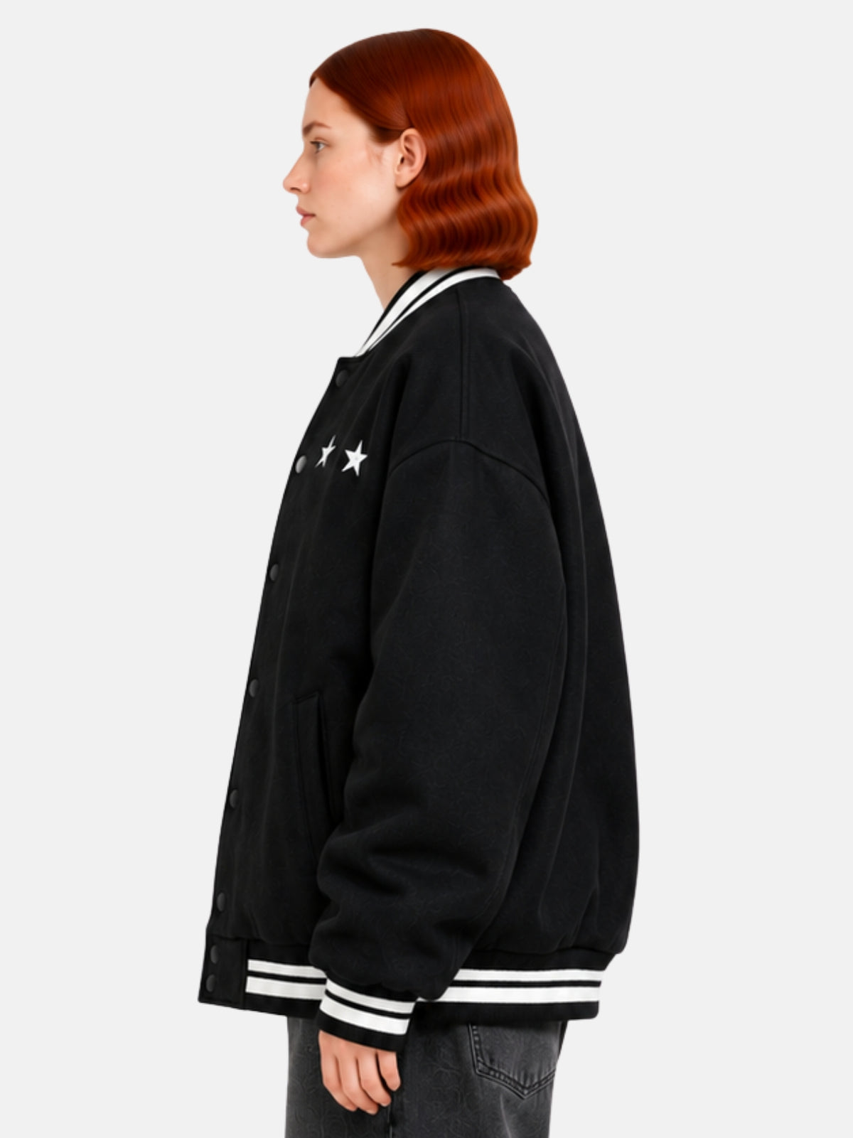 Side profile of oversized black varsity jacket showing balloon sleeve and white ribbing