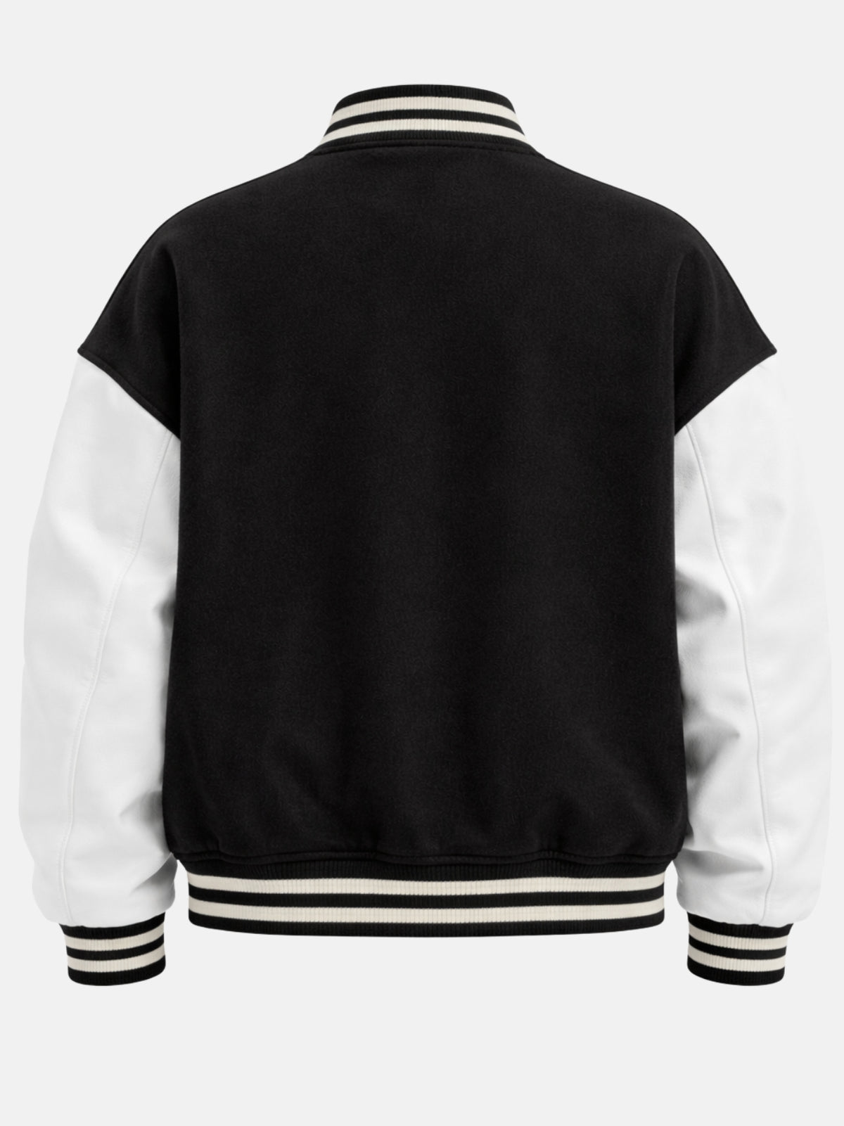 Plain black back of oversized varsity jacket with white leather sleeves and striped knits