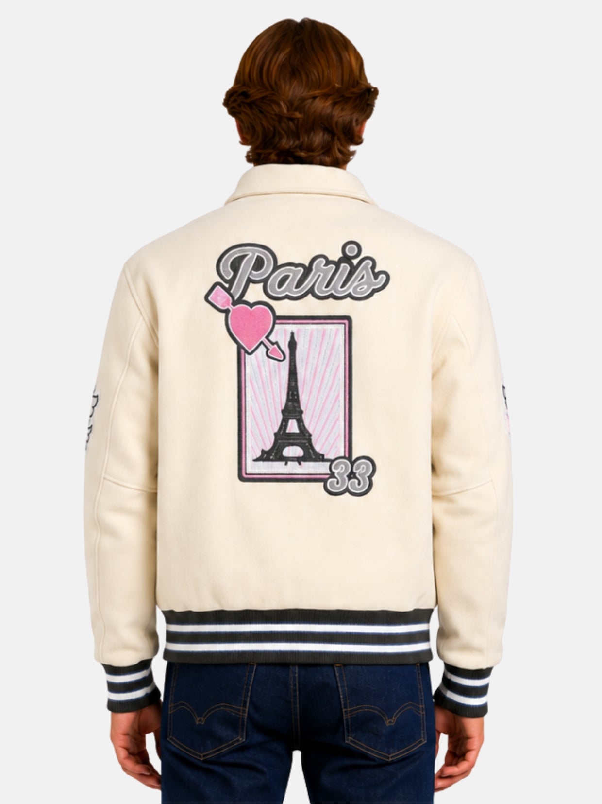 Back view of beige varsity jacket with Paris script and Eiffel Tower postcard patch