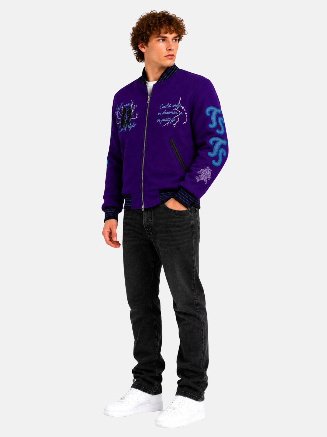 Full-length view of model in purple wool varsity jacket with embroidered chest art
