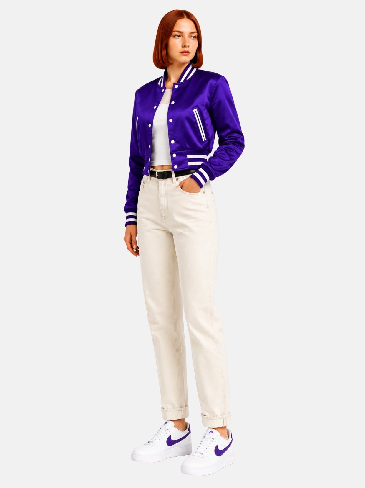 Cropped purple varsity jacket, angled view showing ribbed waistband detail