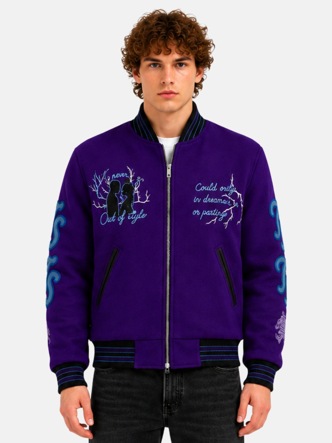 Man wearing a purple embroidered varsity jacket with script lettering and zip front