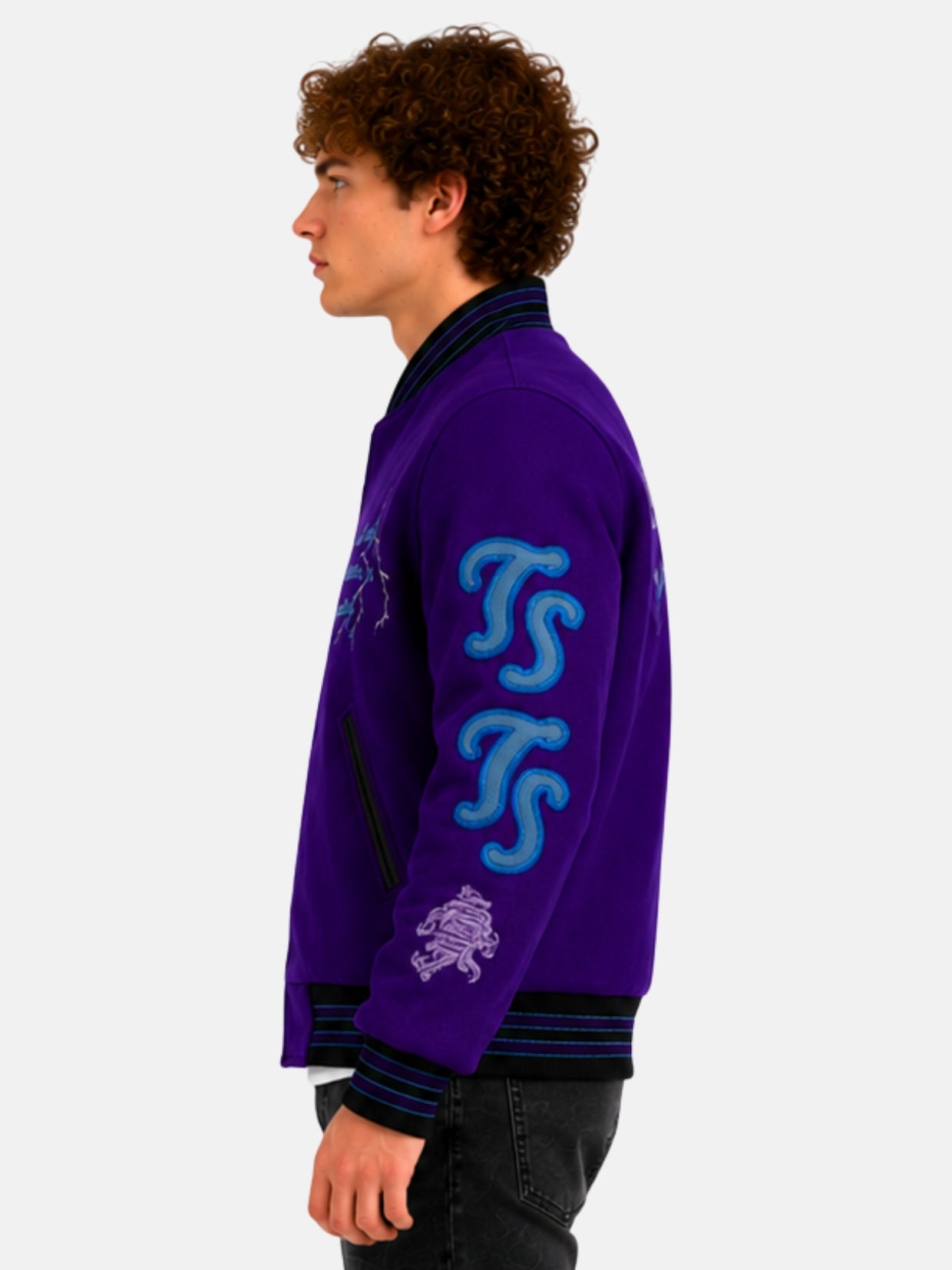 Side profile of purple varsity jacket showing stacked appliqué initials on sleeve