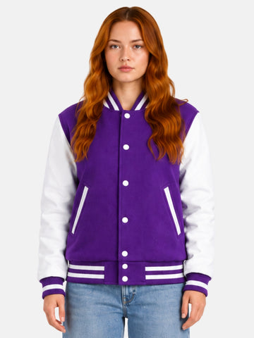 Woman wearing a purple varsity jacket with white leather sleeves and striped rib trims