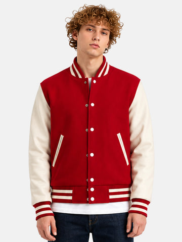 Man wearing a red and white varsity jacket with striped rib trims and white snaps
