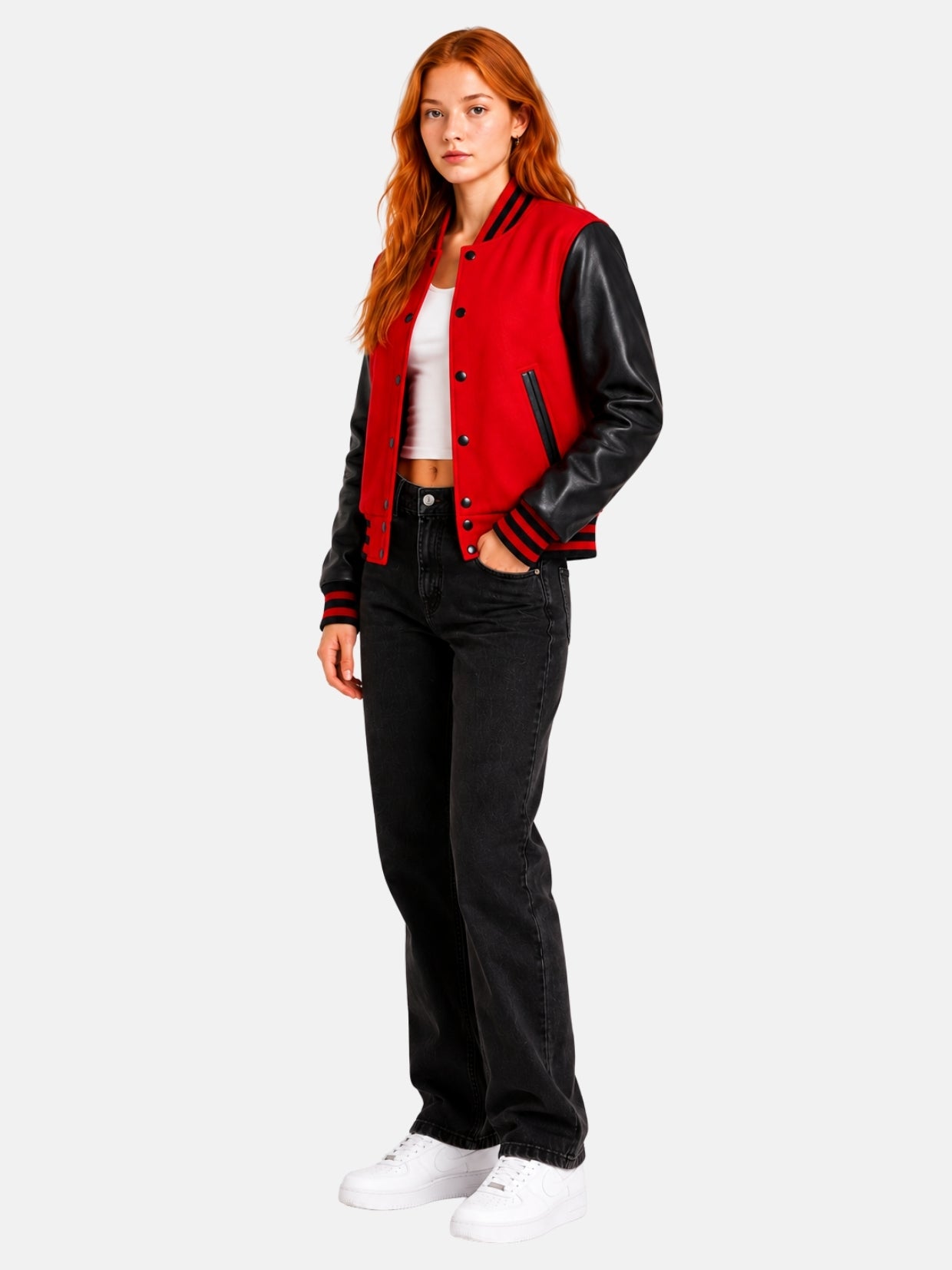Full-length view of female model in red and black varsity jacket with dark denim