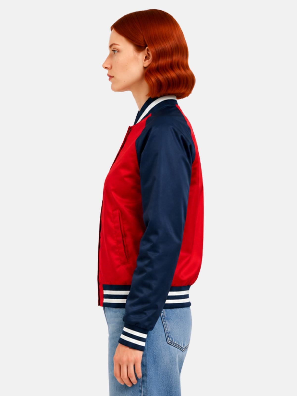 Side profile of red satin jacket showing navy raglan sleeve