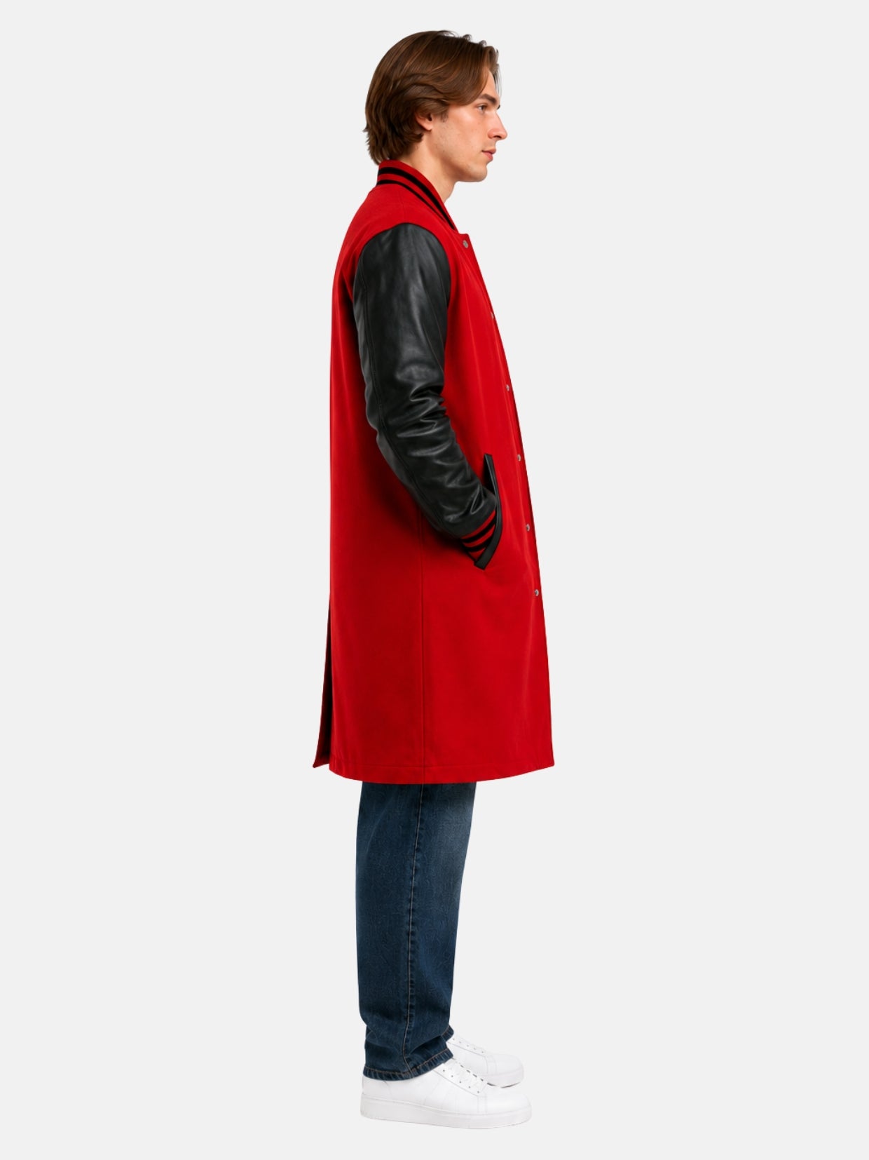 Side profile of red varsity coat showing black leather sleeve and striped knit cuff