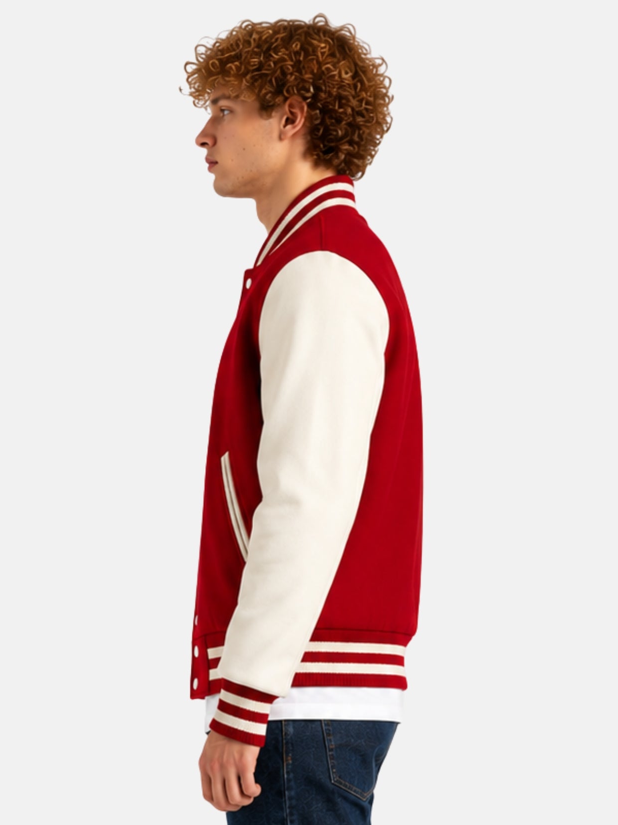 Side profile of red varsity jacket showing cream sleeve and striped cuff