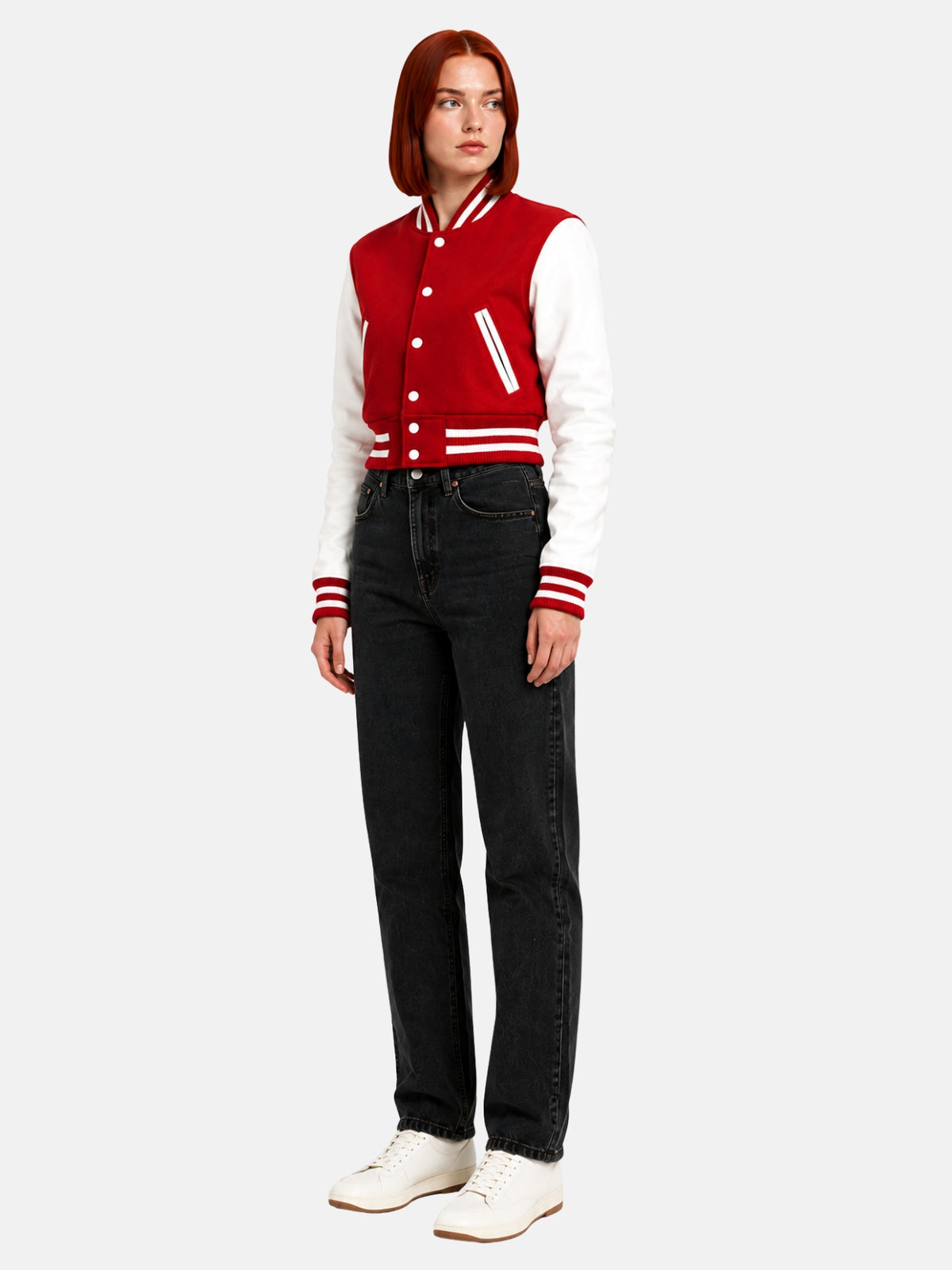 Full-body three-quarter shot of model walking in the red and white jacket, white sneakers