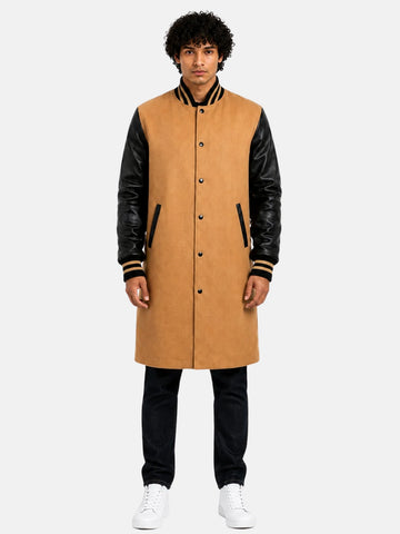 Dark shadow snaps sink into the placket instead of studding it with silver, closing this tan melton wool trench coat with black leather sleeves.