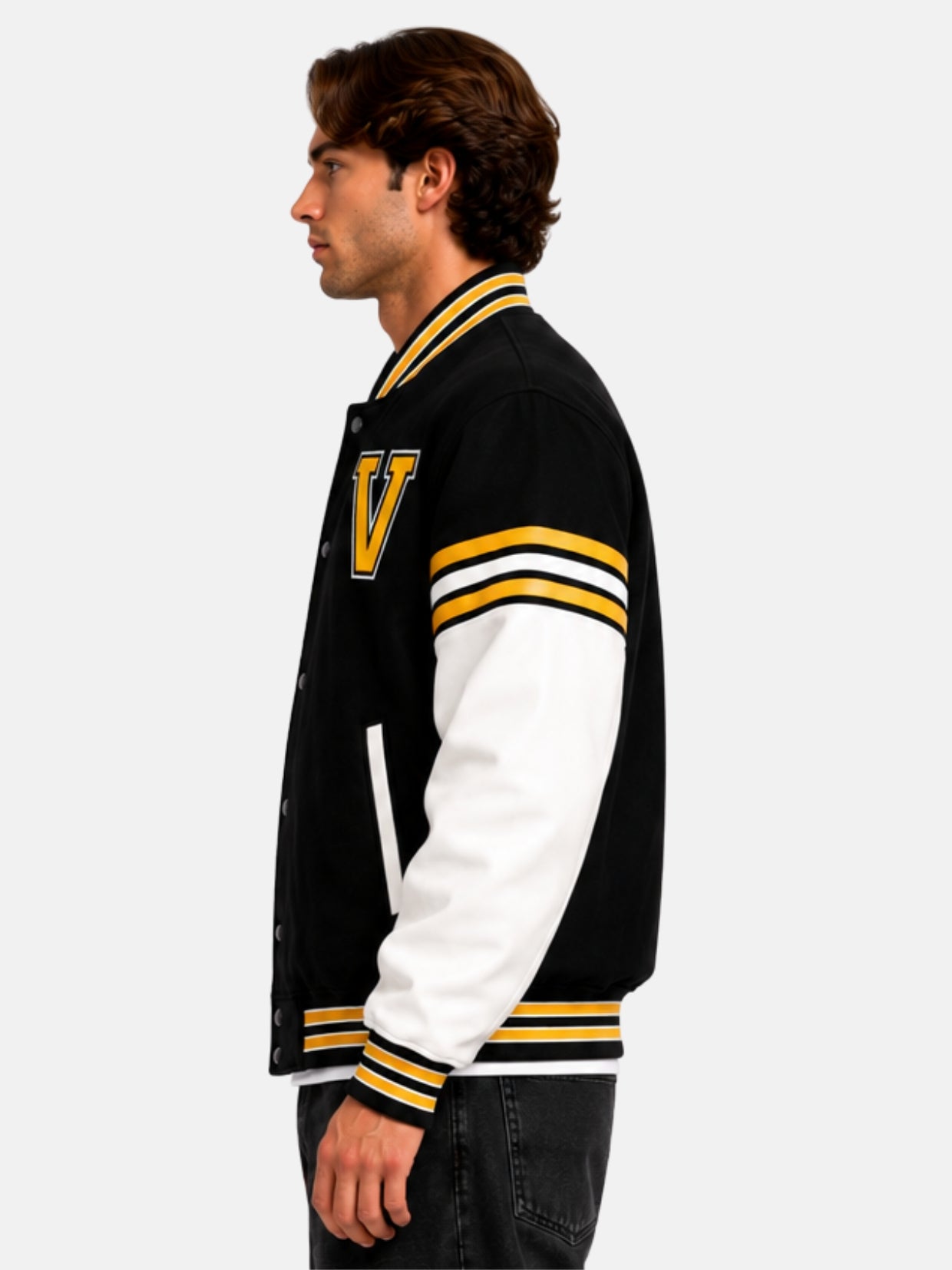 Side profile of oversized Varsity Forge jacket showing V patch and gold striped sleeve band