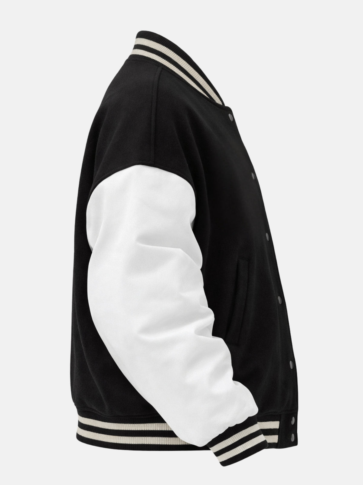 White leather sleeve of oversized black varsity jacket with striped cuff, side view
