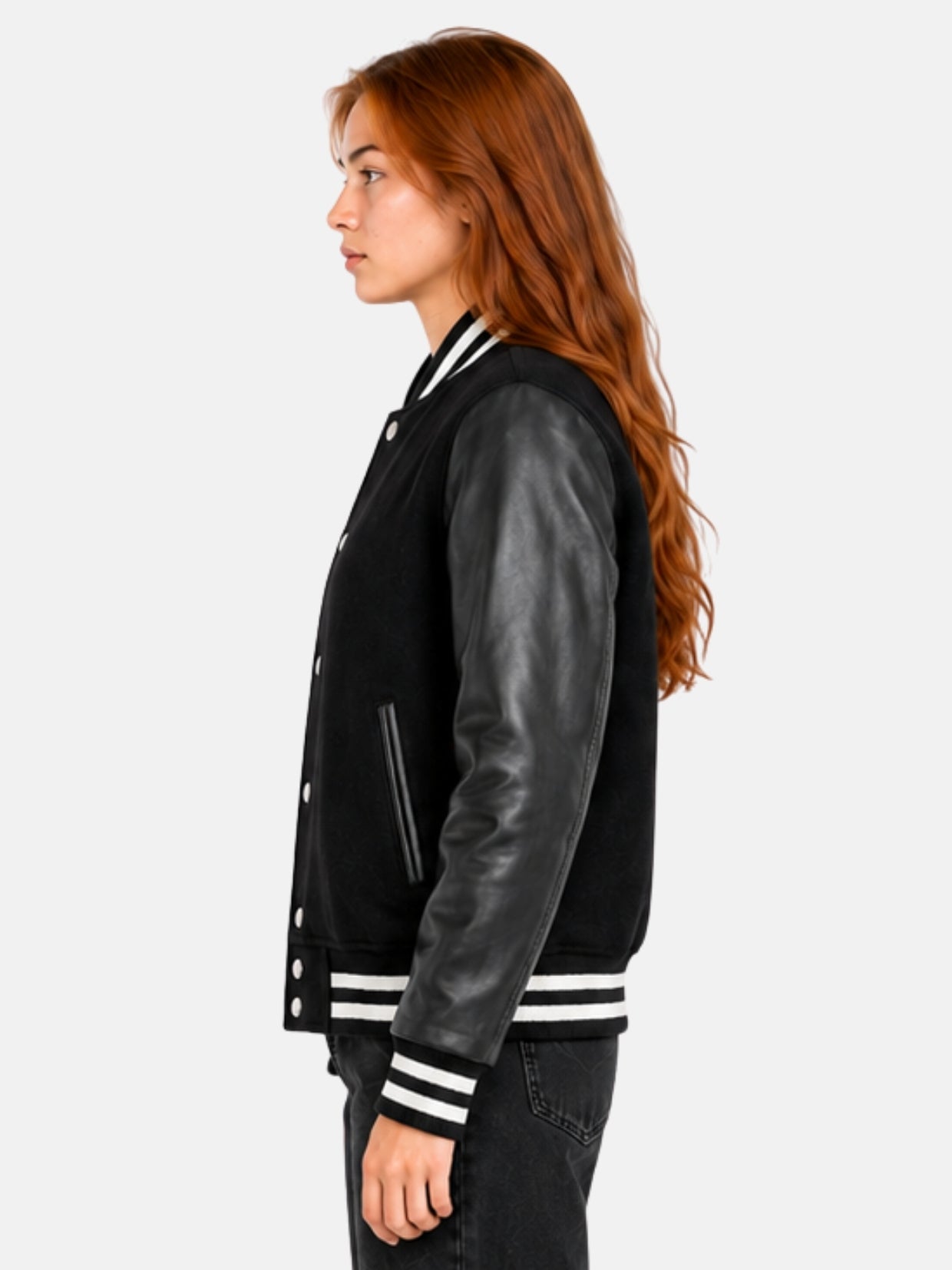 Side profile of womens black varsity jacket showing leather sleeve and striped cuff