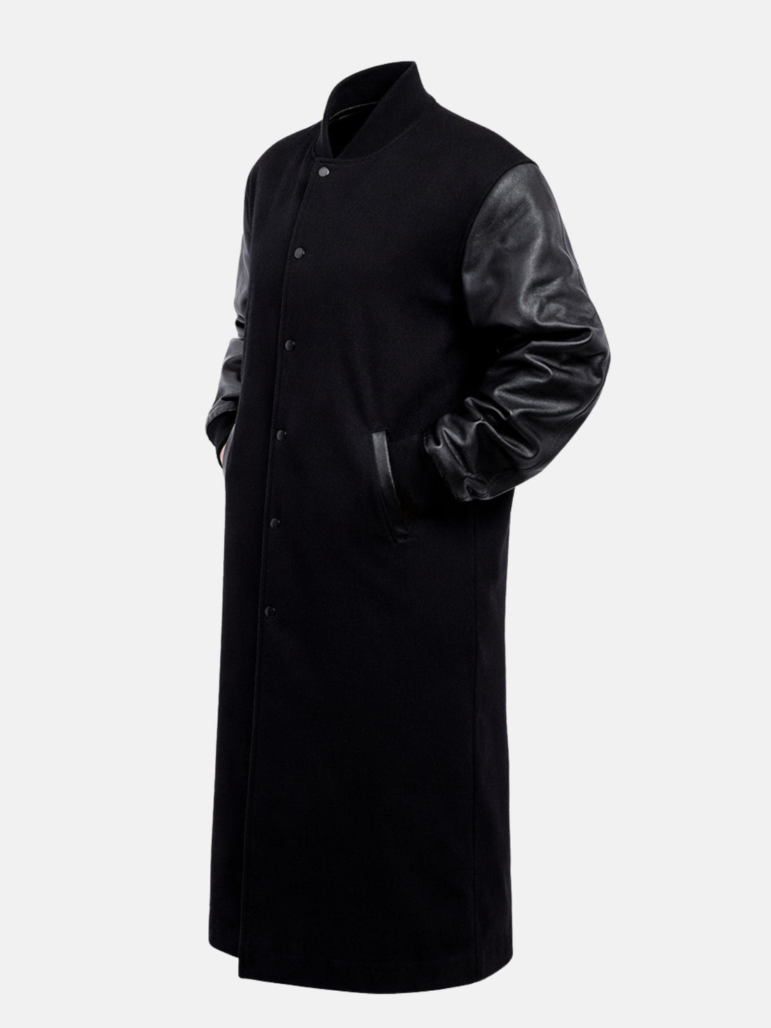 Woman wearing a black longline varsity coat with black leather sleeves, front open